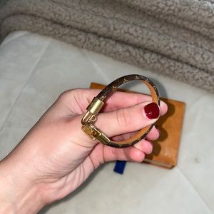 Louis Vuitton clasp bracelet with small purse gold charm